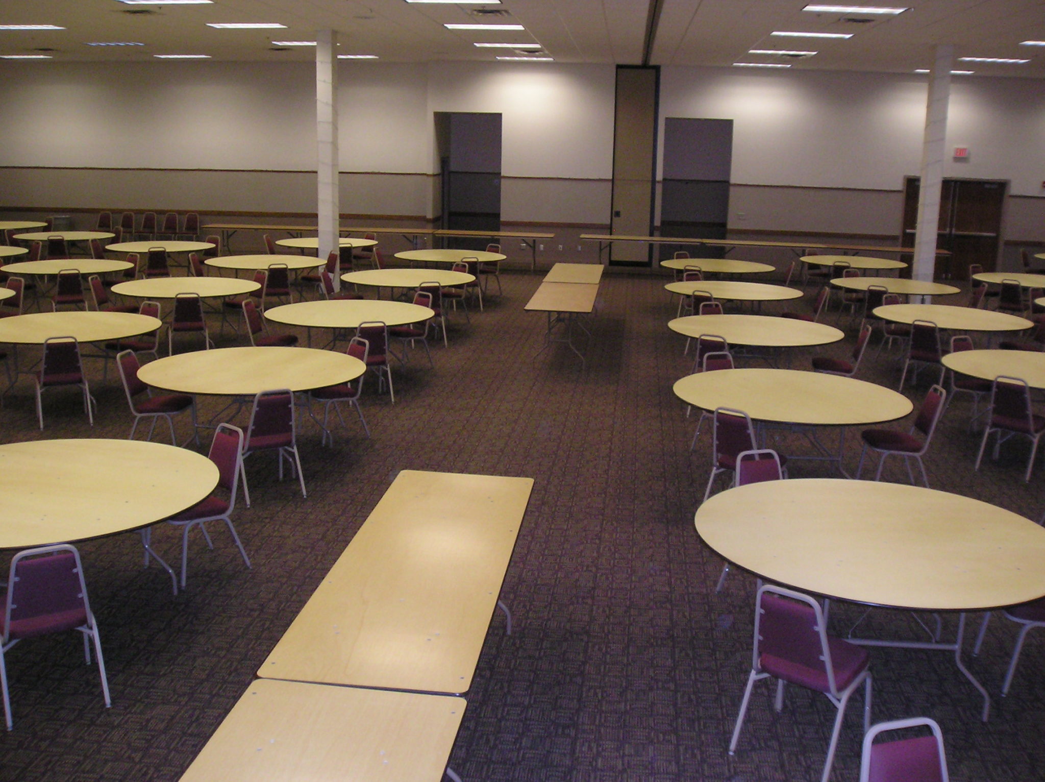 room of undecorated tables and chairs